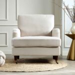 Soft Beige Velvet Armchair with Antique Brass Castor Legs for Elegant Home Seating
