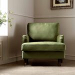 Luxe Olive Green Velvet Armchair with Antique Brass Castor Legs for Elegant Home Seating