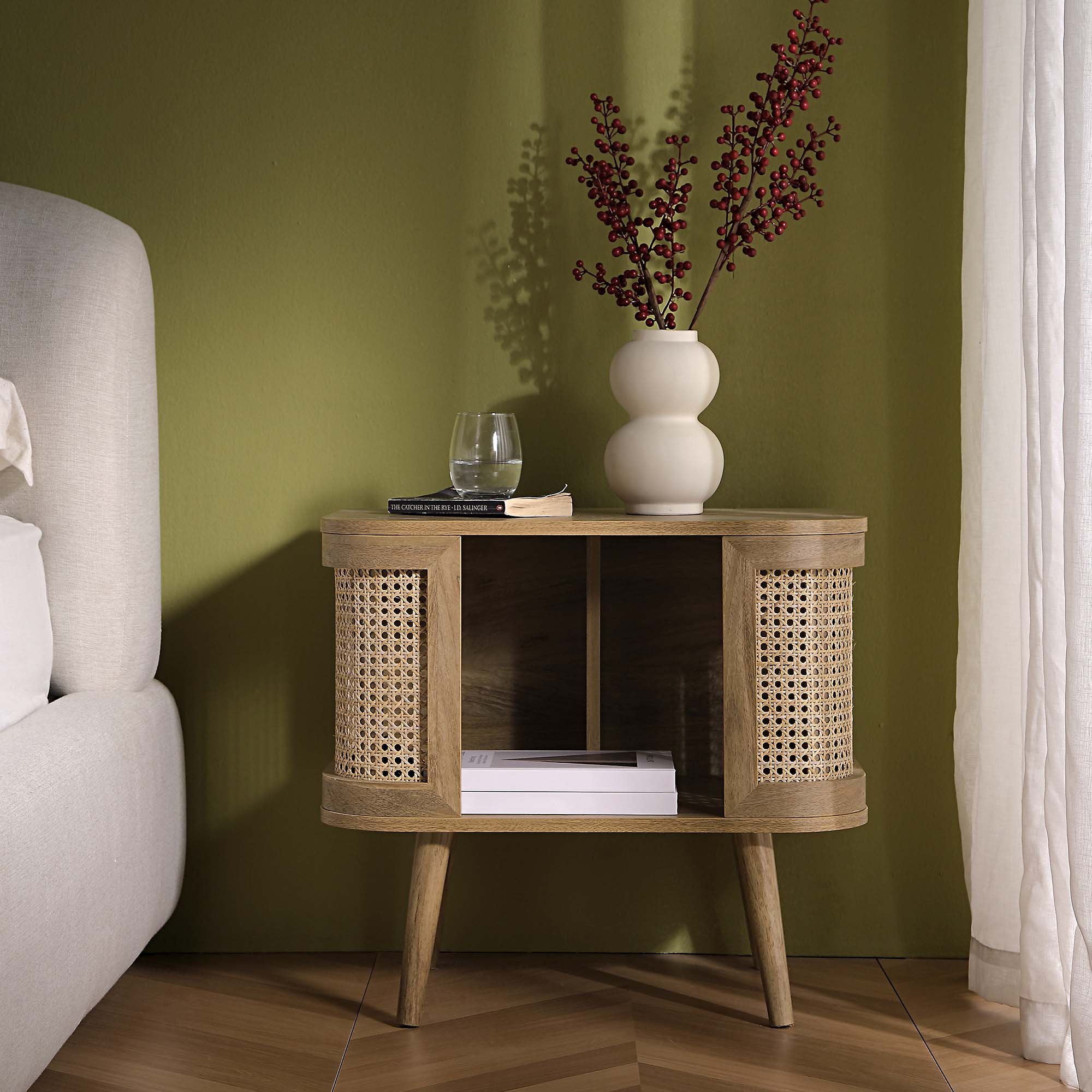 FT-BST-04-NAT_scene1 Natural Curved Rattan Bedside Table - Image 1